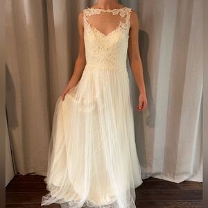 Wedding dress. Never been worn, just doesn’t fit